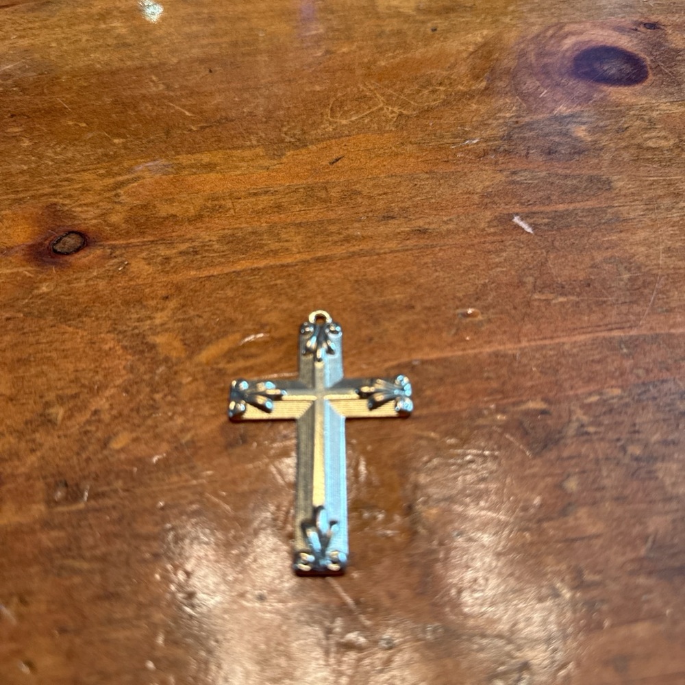 Elegant Gold and Silver Cross Pendant